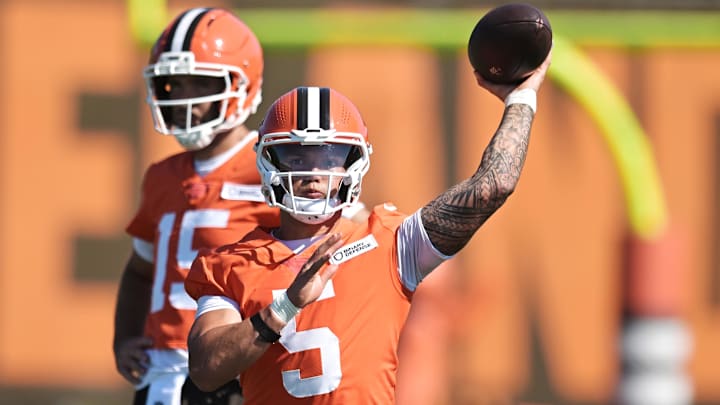Jul 23, 2025; Berea, OH, USA; Cleveland Browns quarterback Dillon Gabriel (5) throws a pass as quarterback Joe Flacco (15) looks on during training camp at CrossCountry Mortgage Campus. Mandatory Credit: Ken Blaze-Imagn Images Jul 23, 2025; Berea, OH, USA; Cleveland Browns quarterback Dillon Gabriel (5) throws a pass as quarterback Joe Flacco (15) looks on during training camp at CrossCountry Mortgage Campus. Mandatory Credit: Ken Blaze-Imagn Images