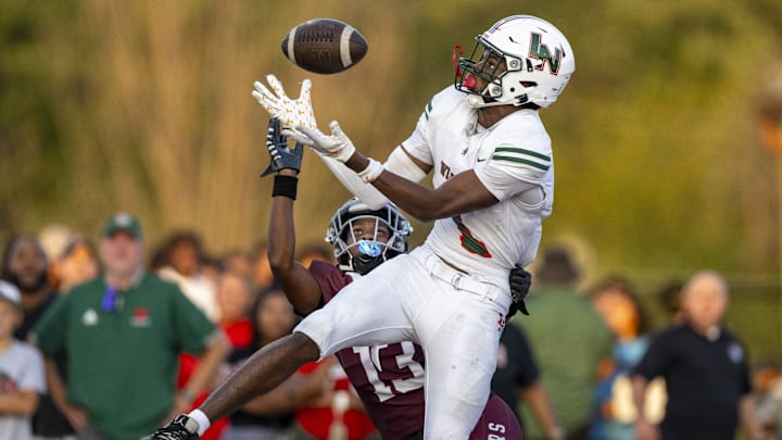 Lawrence North High School sophomore Monshun Sales (1) makes a catch in the end zone to score while being defended by Lawrence Central High School junior DJ Summers (13) during the first half of an IHSAA varsity football game, Friday, Aug. 23, 2024, at Lawrence Central High School. Lawrence North High School sophomore Monshun Sales (1) makes a catch in the end zone to score while being defended by Lawrence Central High School junior DJ Summers (13) during the first half of an IHSAA varsity football game, Friday, Aug. 23, 2024, at Lawrence Central High School.