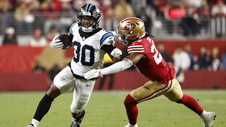 Nov 24, 2025; Santa Clara, California, USA; Carolina Panthers running back Chuba Hubbard (30) rushes the ball against San Francisco 49ers safety Ji'Ayir Brown (27) during the second half at Levi's Stadium. Mandatory Credit: Kelley L Cox-Imagn Images