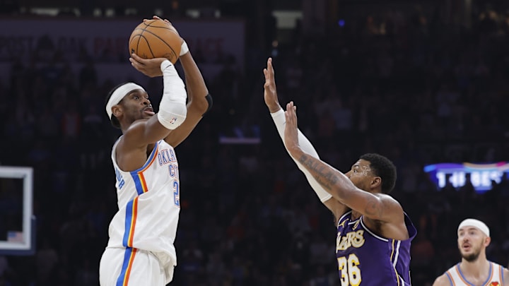 Nov 12, 2025; Oklahoma City, Oklahoma, USA; Oklahoma City Thunder guard Shai Gilgeous-Alexander (2) shoots over Los Angeles Lakers guard Marcus Smart (36) during the second quarter at Paycom Center. Mandatory Credit: Alonzo Adams-Imagn Images