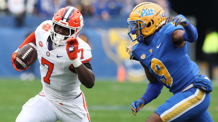 Nov 16, 2024; Pittsburgh, Pennsylvania, USA; Clemson Tigers running back Phil Mafah (7) runs the ball against Pittsburgh Panthers linebacker Kyle Louis (9) during the first quarter at Acrisure Stadium. 