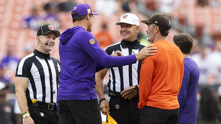 Aug 17, 2024; Cleveland, Ohio, USA; Minnesota Vikings head coach Kevin O'Connell meets with Cleveland Browns head coach Kevin Stefanski side judge Jonah Monroe (120) and referee Clete Blakeman (34) before the game at Cleveland Browns Stadium.
