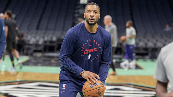 Jan 31, 2025; Charlotte, North Carolina, USA; LA Clippers guard Norman Powell (24) shoots during pregame warm ups at Spectrum Center. Mandatory Credit: Jim Dedmon-Imagn Images