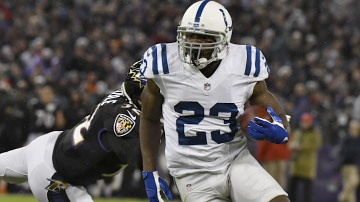 Dec 23, 2017; Baltimore, MD, USA; Indianapolis Colts running back Frank Gore (23) runs past Baltimore Ravens safety Eric Weddle (32) during the second quarter at M&T Bank Stadium. Mandatory Credit: Tommy Gilligan-Imagn Images
