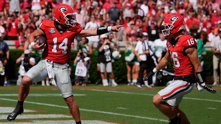 Georgia quarterback Gunner Stockton (14) celebrates with Georgia wide receiver London Humphreys (16) while walking in for a touchdown during the first half of a NCAA college football game against Marshall in Athens, Ga., on Saturday, August. 30, 2025.