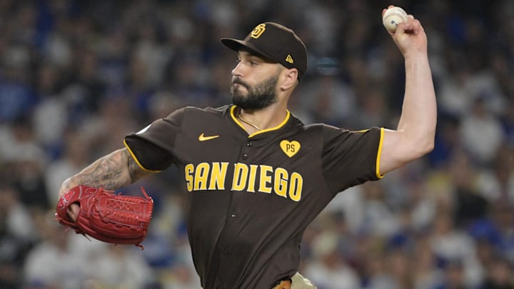 Oct 6, 2024; Los Angeles, California, USA; San Diego Padres pitcher Tanner Scott (66) pitches against the Los Angeles Dodgers in the eighth inning during game two of the NLDS for the 2024 MLB Playoffs at Dodger Stadium