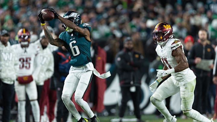 Nov 14, 2024; Philadelphia, Pennsylvania, USA; Philadelphia Eagles wide receiver DeVonta Smith (6) makes a catch in front of Washington Commanders safety Jeremy Chinn (11) during the second quarter at Lincoln Financial Field. Mandatory Credit: Bill Streicher-Imagn Images Nov 14, 2024; Philadelphia, Pennsylvania, USA; Philadelphia Eagles wide receiver DeVonta Smith (6) makes a catch in front of Washington Commanders safety Jeremy Chinn (11) during the second quarter at Lincoln Financial Field. Mandatory Credit: Bill Streicher-Imagn Images