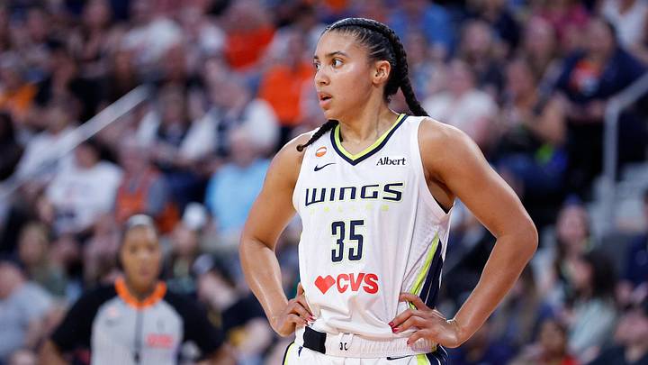 Azzi Fudd looks on during a Dallas Wings game.