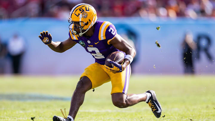 Jan 1, 2024; Tampa, FL, USA; LSU Tigers wide receiver Kyren Lacy (2) runs with the ball during the second half against the Wisconsin Badgers.