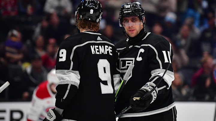Nov 25, 2023; Los Angeles, California, USA; Los Angeles Kings center Anze Kopitar (11) speaks with center Adrian Kempe (9) during the third period at Crypto.com Arena. Mandatory Credit: Gary A. Vasquez-Imagn Images