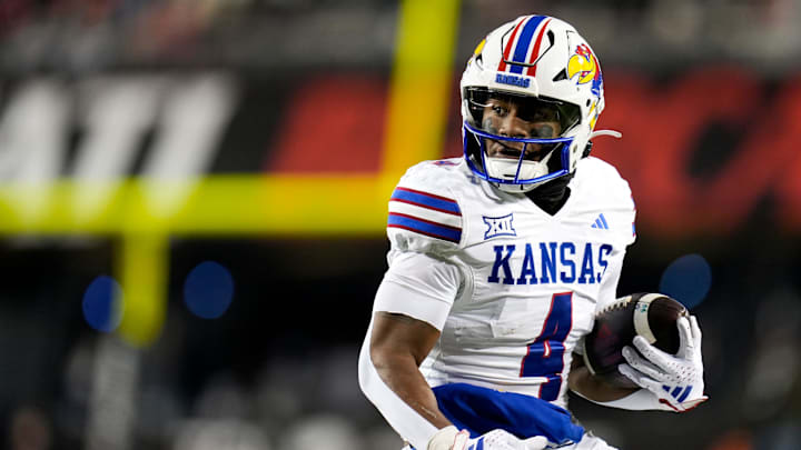 Kansas Jayhawks running back Devin Neal (4) scores a touch down during the NCAA college football game between the Cincinnati Bearcats and Kansas Jayhawks on Saturday, Nov. 25, 2023.