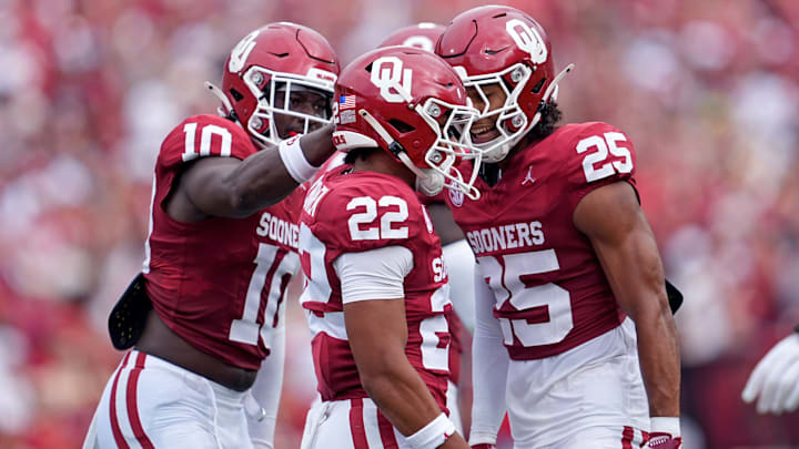 Oklahoma's Peyton Bowen (22), Kip Lewis (10) and Michael Boganowski (25) celebrate a big play against Illinois State. Oklahoma's Peyton Bowen (22), Kip Lewis (10) and Michael Boganowski (25) celebrate a big play against Illinois State.