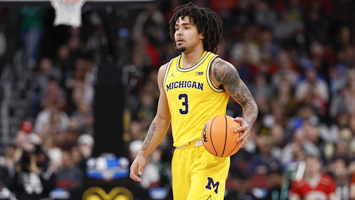 Mar 14, 2026; Chicago, IL, USA; Michigan Wolverines guard Elliot Cadeau (3) brings the ball up court against the Wisconsin Badgers during the second half at United Center. Mandatory Credit: Kamil Krzaczynski-Imagn Images