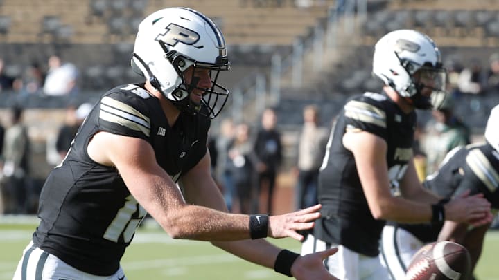 Purdue Boilermakers quarterback Ryan Browne (15) takes a snap 