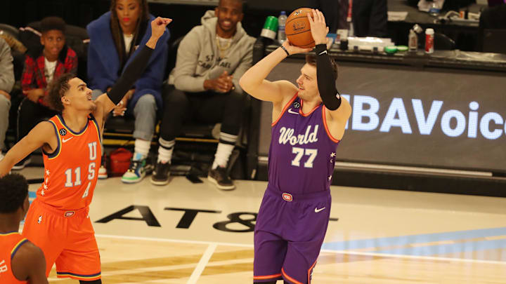 Feb 14, 2020; Chicago, Illinois, USA; World forward Luka Doncic of the Dallas Mavericks shoots over USA guard Trae Young of the Atlanta Hawks during the NBA Rising Stars basketball game at United Center. Mandatory Credit: Dennis Wierzbicki-Imagn Images