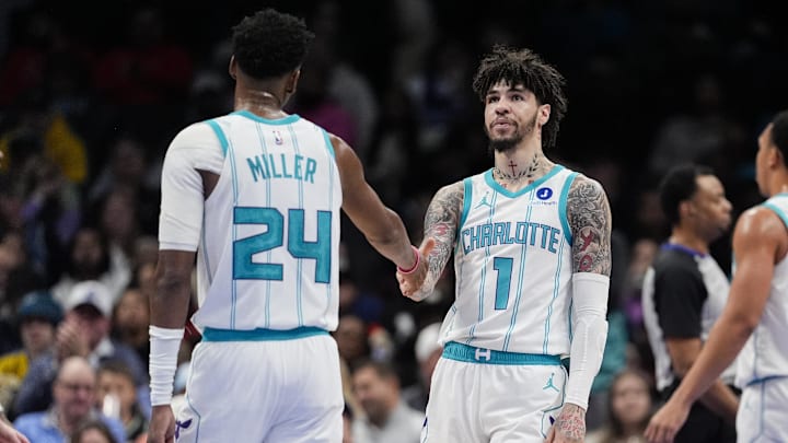 Feb 2, 2026; Charlotte, North Carolina, USA;Charlotte Hornets guard LaMelo Ball (1) and forward Brandon Miller (24) high five  during the second quarter against the New Orleans Pelicans at the Spectrum Center. Mandatory Credit: Jim Dedmon-Imagn Images