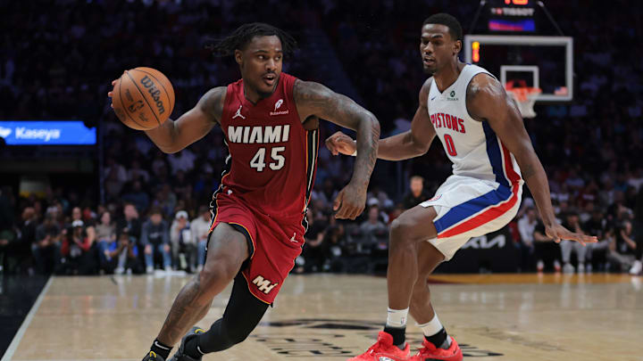 Mar 19, 2025; Miami, Florida, USA; Miami Heat guard Davion Mitchell (45) drives to the basket past Detroit Pistons center Jalen Duren (0) during the second quarter at Kaseya Center. Mandatory Credit: Sam Navarro-Imagn Images