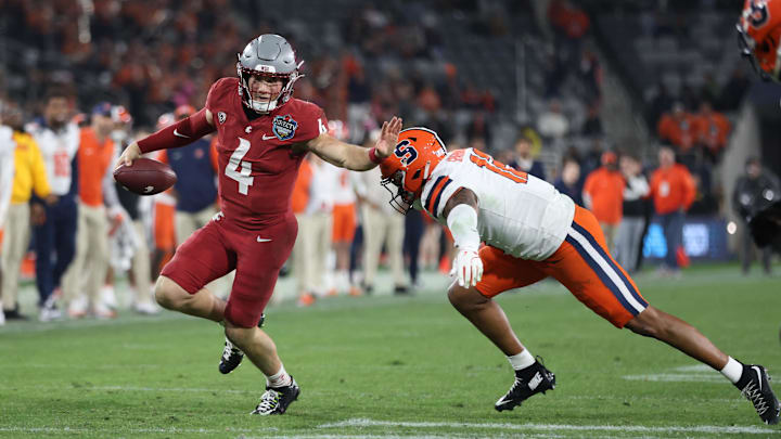 Dec 27, 2024; San Diego, CA, USA; Washington State Cougars quarterback Zevi Eckhaus (4) runs the ball against Syracuse Orange defense during the second half at Snapdragon Stadium. Mandatory Credit: Abe Arredondo-Imagn Images