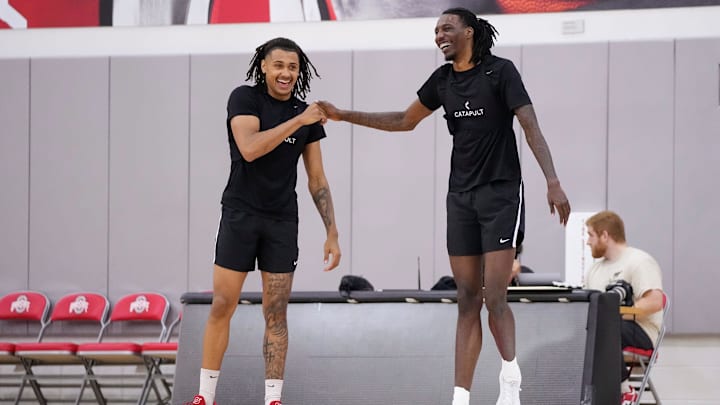 Jul 9, 2024; Columbus, OH, USA; Ohio State Buckeyes forward Devin Royal gets a handshake from forward Aaron Bradshaw during a summer workout in the practice gym at the Schottenstein Center. Jul 9, 2024; Columbus, OH, USA; Ohio State Buckeyes forward Devin Royal gets a handshake from forward Aaron Bradshaw during a summer workout in the practice gym at the Schottenstein Center.