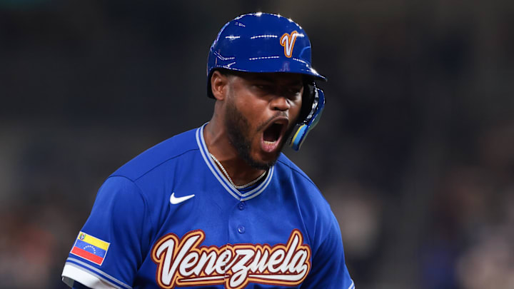 Mar 14, 2026; Miami, FL, United States; Venezuela third baseman Maikel Garcia (11) celebrates after hitting a two-run home run against Japan in the fifth inning during a quarterfinal game of the 2026 World Baseball Classic at loanDepot Park. Mandatory Credit: Sam Navarro-Imagn Images