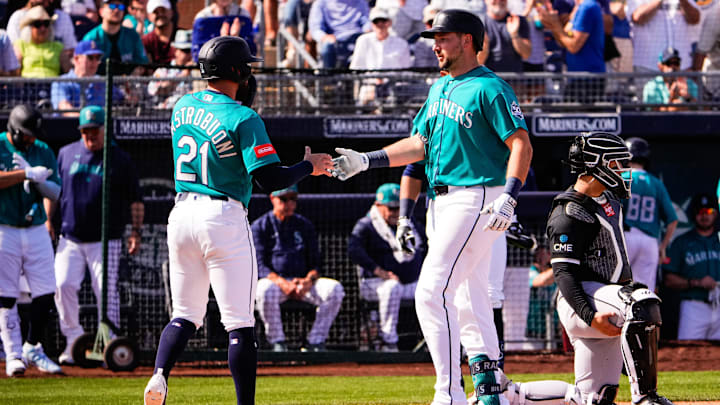 Feb 24, 2026; Peoria, Arizona, USA; Seattle Mariners catcher Cal Raleigh (29) and third baseman Miles Mastrobuoni (21) celebrate after Raleigh’s two-run home run during the third inning against the Chicago White Sox in Peoria, Arizona. Mandatory Credit: Arianna Grainey-Imagn Images Feb 24, 2026; Peoria, Arizona, USA; Seattle Mariners catcher Cal Raleigh (29) and third baseman Miles Mastrobuoni (21) celebrate after Raleigh’s two-run home run during the third inning against the Chicago White Sox in Peoria, Arizona. Mandatory Credit: Arianna Grainey-Imagn Images