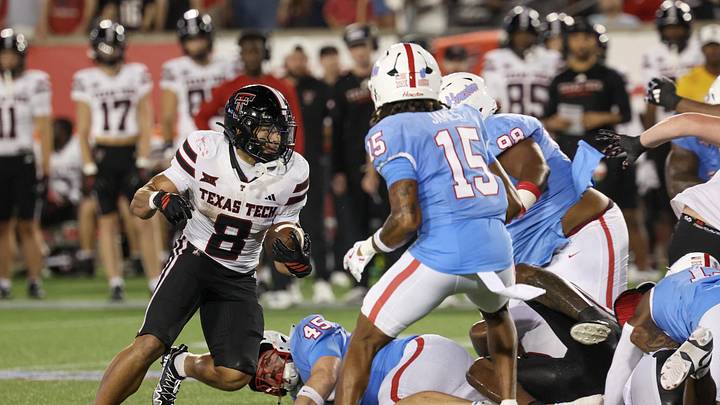 Oct 4, 2025; Houston, Texas, USA; Texas Tech Red Raiders running back Cameron Dickey (8) rushes against Houston Cougars defensive back Will James (15) in the second half at TDECU Stadium. Mandatory Credit: Thomas Shea-Imagn Images Oct 4, 2025; Houston, Texas, USA; Texas Tech Red Raiders running back Cameron Dickey (8) rushes against Houston Cougars defensive back Will James (15) in the second half at TDECU Stadium. Mandatory Credit: Thomas Shea-Imagn Images