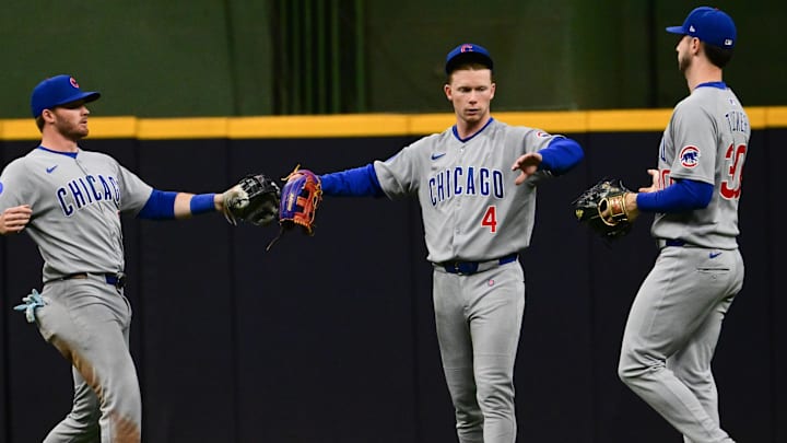 May 3, 2025; Milwaukee, Wisconsin, USA;  Chicago Cubs left fielder Ian Happ (8), center fielder Pete Crow-Armstrong (4) and right fielder Kyle Tucker (30) celebrate after beating the Milwaukee Brewers at American Family Field.