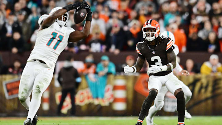 Cleveland Browns wide receiver Jerry Jeudy (3) watches as Miami Dolphins linebacker Tyrel Dodson (11) intercepts the pass during the first half at Huntington Bank Field.