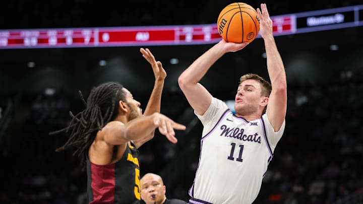 Mar 11, 2025; Kansas City, MO, USA; Kansas State Wildcats guard Brendan Hausen (11) shoots the ball over Arizona State Sun Devils guard Amier Ali (5) during the first half at T-Mobile Center.