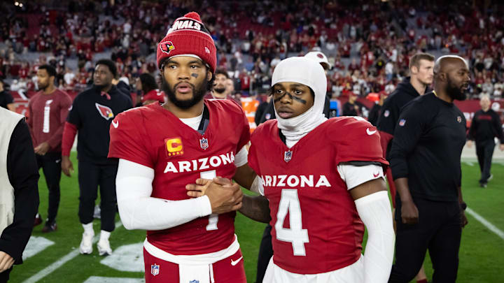 Jan 5, 2025; Glendale, Arizona, USA; Arizona Cardinals quarterback Kyler Murray (1) celebrates with wide receiver Greg Dortch (4) after defeating the San Francisco 49ers at State Farm Stadium. Mandatory Credit: Mark J. Rebilas-Imagn Images