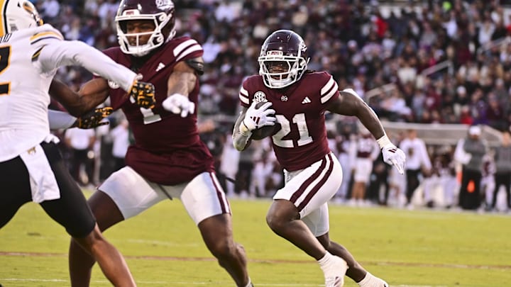 Nov 23, 2024; Starkville, Mississippi, USA; Mississippi State Bulldogs running back Davon Booth (21) runs against the Missouri Tigers during the second quarter at Davis Wade Stadium at Scott Field. Mandatory Credit: Matt Bush-Imagn Images