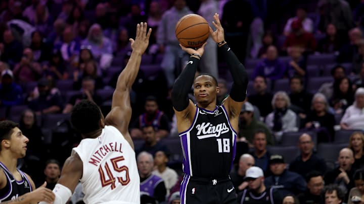 Feb 7, 2026; Sacramento, California, USA; Sacramento Kings guard Russel Westbrook (18) shoots over Cleveland Cavaliers guard Donovan Mitchell (45) during the first quarter at Golden 1 Center. Mandatory Credit: Dennis Lee-Imagn Images