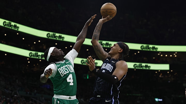 Orlando Magic forward Paolo Banchero (5) shoots over Boston Celtics guard Jrue Holiday (4) during the second quarter of game two of the first round of the 2024 NBA Playoffs at TD Garden. Orlando Magic forward Paolo Banchero (5) shoots over Boston Celtics guard Jrue Holiday (4) during the second quarter of game two of the first round of the 2024 NBA Playoffs at TD Garden.
