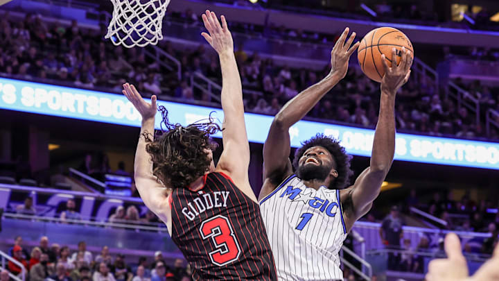 Dec 1, 2025; Orlando, Florida, USA; Orlando Magic forward Jonathan Isaac (1) goes to the basket against Chicago Bulls guard Josh Giddey (3) during the second quarter at Kia Center. Mandatory Credit: Mike Watters-Imagn Images