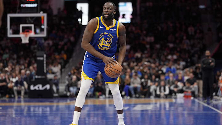 Dec 31, 2025; Charlotte, North Carolina, USA; Golden State Warriors forward Draymond Green (23) handles the ball against the Charlotte Hornets during the second half at Spectrum Center. Mandatory Credit: Jim Dedmon-Imagn Images