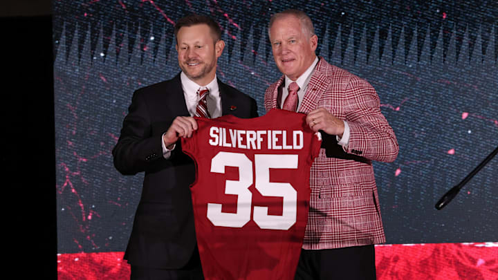 Dec 1, 2025; Fayetteville, AR, USA; Arkansas Razorbacks head football coach Ryan Silverfield is introduced by vice chancellor and director of athletics Hunter Yurachek during a public held at the Walker Indoor Pavilion. Mandatory Credit: Nelson Chenault-Imagn Images