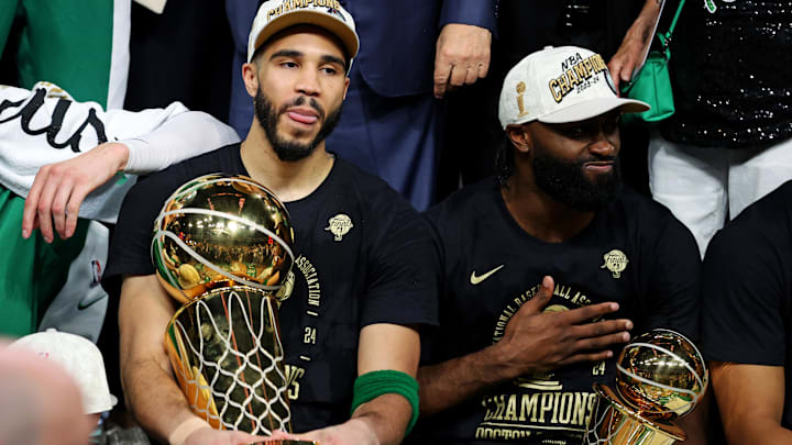 Jun 17, 2024; Boston, Massachusetts, USA; Boston Celtics forward Jayson Tatum (0) and guard Jaylen Brown (7) celebrates with the Larry O’Brian Trophy after beating the Dallas Mavericks in game five of the 2024 NBA Finals to win the NBA Championship at TD Garden. Mandatory Credit: Peter Casey-Imagn Images
