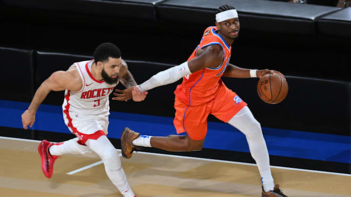 Dec 14, 2024; Las Vegas, Nevada, USA; Oklahoma City Thunder guard Shai Gilgeous-Alexander (2) controls the ball against Houston Rockets guard Fred VanVleet (5) during the fourth quarter in a semifinal of the 2024 Emirates NBA Cup at T-Mobile Arena. Mandatory Credit: Candice Ward-Imagn Images Dec 14, 2024; Las Vegas, Nevada, USA; Oklahoma City Thunder guard Shai Gilgeous-Alexander (2) controls the ball against Houston Rockets guard Fred VanVleet (5) during the fourth quarter in a semifinal of the 2024 Emirates NBA Cup at T-Mobile Arena. Mandatory Credit: Candice Ward-Imagn Images