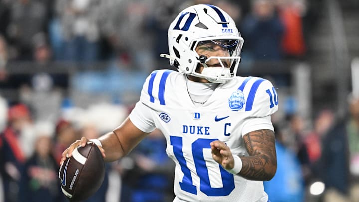 Dec 6, 2025; Charlotte, NC, USA; Duke Blue Devils quarterback Darian Mensah (10) looks to throw in the second quarter against the Virginia Cavaliers during the 2025 ACC Championship game at Bank of America Stadium. Mandatory Credit: Bob Donnan-Imagn Images Dec 6, 2025; Charlotte, NC, USA; Duke Blue Devils quarterback Darian Mensah (10) looks to throw in the second quarter against the Virginia Cavaliers during the 2025 ACC Championship game at Bank of America Stadium. Mandatory Credit: Bob Donnan-Imagn Images