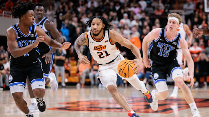 Feb 4, 2026; Stillwater, Oklahoma, USA; Oklahoma State Cowboys guard Isaiah Coleman (21) dribbles during the first half against the BYU Cougars at Gallagher-Iba Arena. Mandatory Credit: William Purnell-Imagn Images