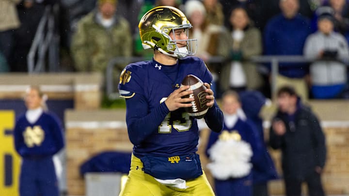 Nov 8, 2025; South Bend, Indiana, USA; Notre Dame Fighting Irish quarterback CJ Carr (13) looks to pass against the Navy Midshipmen during the first half at Notre Dame Stadium. Mandatory Credit: Michael Caterina-Imagn Images Nov 8, 2025; South Bend, Indiana, USA; Notre Dame Fighting Irish quarterback CJ Carr (13) looks to pass against the Navy Midshipmen during the first half at Notre Dame Stadium. Mandatory Credit: Michael Caterina-Imagn Images