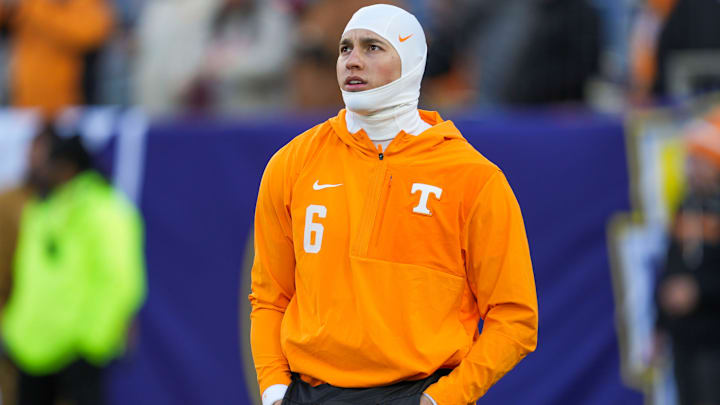 Tennessee quarterback Joey Aguilar (6) keeps his hands warm during warm-ups at the 2025 Music City Bowl at Nissan Stadium in Nashville, Tenn., on Dec. 30, 2025.