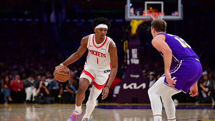 Apr 29, 2026; Los Angeles, California, USA; Houston Rockets guard Amen Thompson (1) moves the ball against Los Angeles Lakers guard Luke Kennard (10) during the second half in game five of the first round of the 2026 NBA Playoffs at Crypto.com Arena. Mandatory Credit: Gary A. Vasquez-Imagn Images