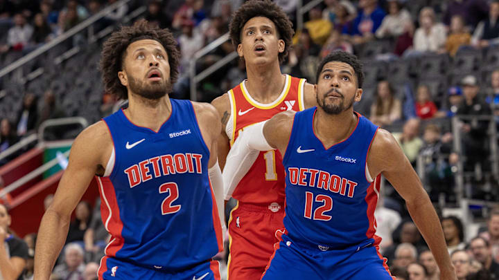 Nov 8, 2024; Detroit, Michigan, USA; Detroit Pistons guard Cade Cunningham (2) and forward Tobias Harris (12) block out Atlanta Hawks forward Jalen Johnson (1) during the first half at Little Caesars Arena. Mandatory Credit: David Reginek-Imagn Images Nov 8, 2024; Detroit, Michigan, USA; Detroit Pistons guard Cade Cunningham (2) and forward Tobias Harris (12) block out Atlanta Hawks forward Jalen Johnson (1) during the first half at Little Caesars Arena. Mandatory Credit: David Reginek-Imagn Images