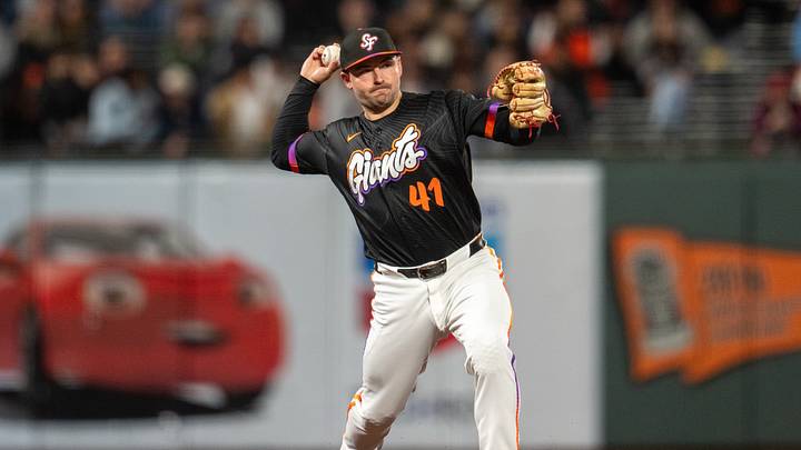 Aug 25, 2026; San Francisco, California, USA;  San Francisco Giants third baseman Buddy Kennedy (41) throws out Cincinnati Reds catcher Tyler Stephenson (not pictured) during the ninth inning at Oracle Park.  Mandatory Credit: Neville E. Guard-Imagn Images