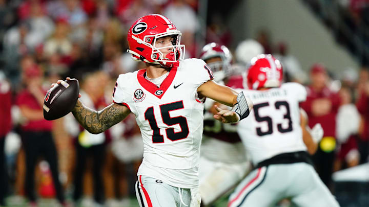 Sep 28, 2024; Tuscaloosa, Alabama, USA; Georgia Bulldogs quarterback Carson Beck (15) rolls out to throw against the Alabama Crimson Tide during the third quarter at Bryant-Denny Stadium. Mandatory Credit: John David Mercer-Imagn Images Sep 28, 2024; Tuscaloosa, Alabama, USA; Georgia Bulldogs quarterback Carson Beck (15) rolls out to throw against the Alabama Crimson Tide during the third quarter at Bryant-Denny Stadium. Mandatory Credit: John David Mercer-Imagn Images