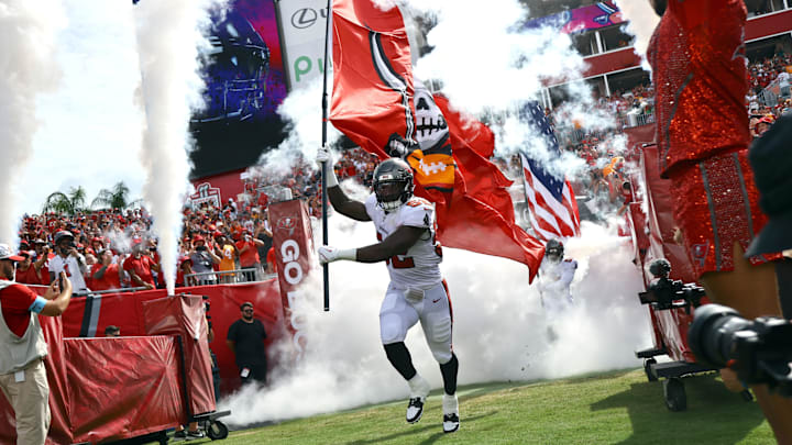 Sep 8, 2024; Tampa, Florida, USA;  Tampa Bay Buccaneers linebacker K.J. Britt (52) runs out of the tunnel as they are introduced before the game Washington Commanders at Raymond James Stadium. Mandatory Credit: Kim Klement Neitzel-Imagn Images