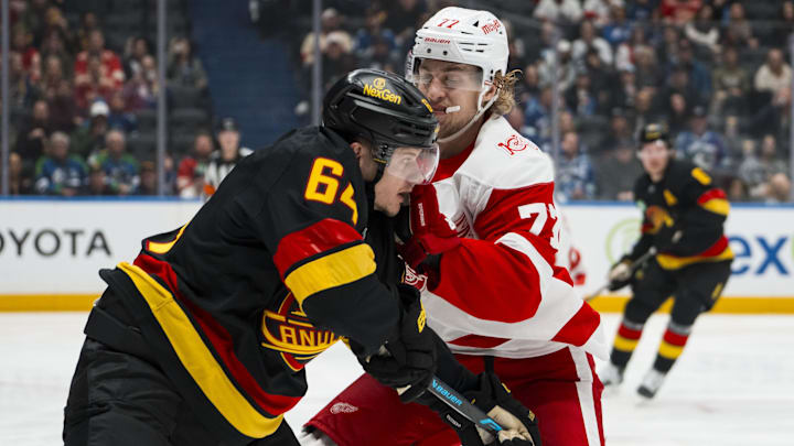 Dec 8, 2025; Vancouver, British Columbia, CAN; Detroit Red Wings defenseman Simon Edvinsson (77) checks Vancouver Canucks forward David Kampf (64) in the second period at Rogers Arena. Mandatory Credit: Bob Frid-Imagn Images Dec 8, 2025; Vancouver, British Columbia, CAN; Detroit Red Wings defenseman Simon Edvinsson (77) checks Vancouver Canucks forward David Kampf (64) in the second period at Rogers Arena. Mandatory Credit: Bob Frid-Imagn Images