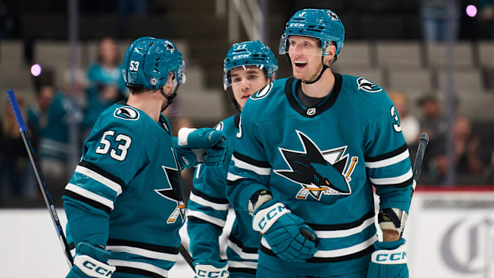 Sep 21, 2025; San Jose, California, USA; San Jose Sharks defenseman John Klingberg (3) celebrates with left wing Jeff Skinner (53) and forward Michael Misa (77) after scoring a power play goal against the Vegas Golden Knights during the second period at SAP Center at San Jose. Mandatory Credit: Robert Edwards-Imagn Images