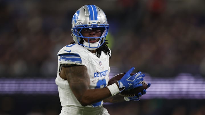 Detroit Lions running back Jahmyr Gibbs (0) rushes the ball against the Baltimore Ravens during the first half at M&T Bank Stadium. 